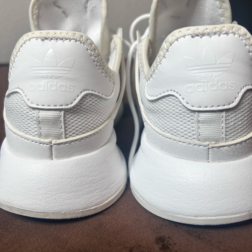 Woman’s Adidas tennis Shoes. Loved but still in great condition.